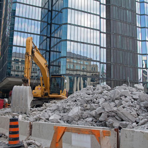 Braxton Demolition providing commercial demolition services in Houston and Katy, Texas, showcasing heavy machinery at a construction site.